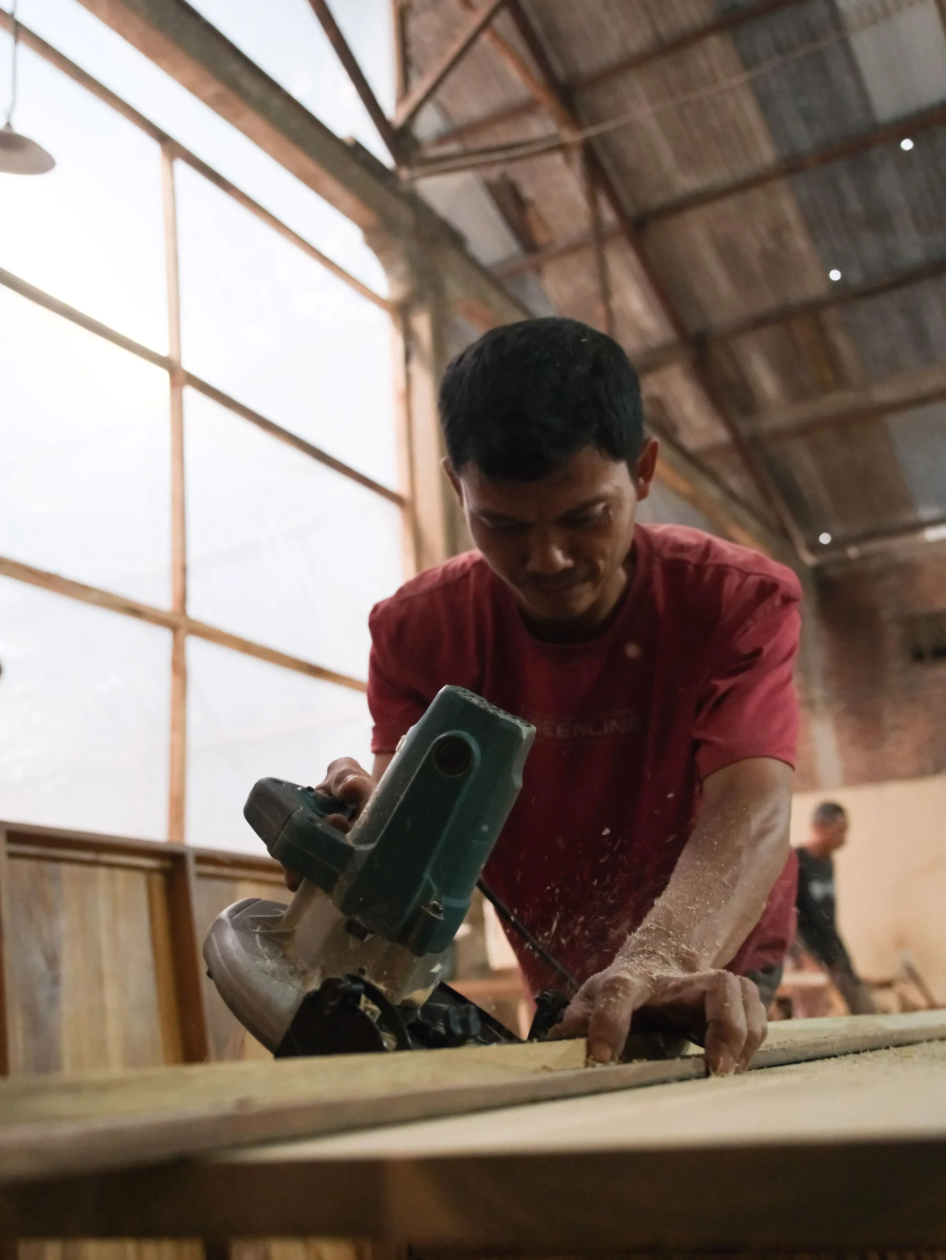 Raw teak timber in production at Apta Living factory, Jepara Indonesia